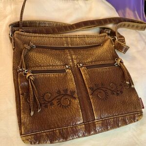 Vintage crossbody with embroidery on pockets with a lot of room.